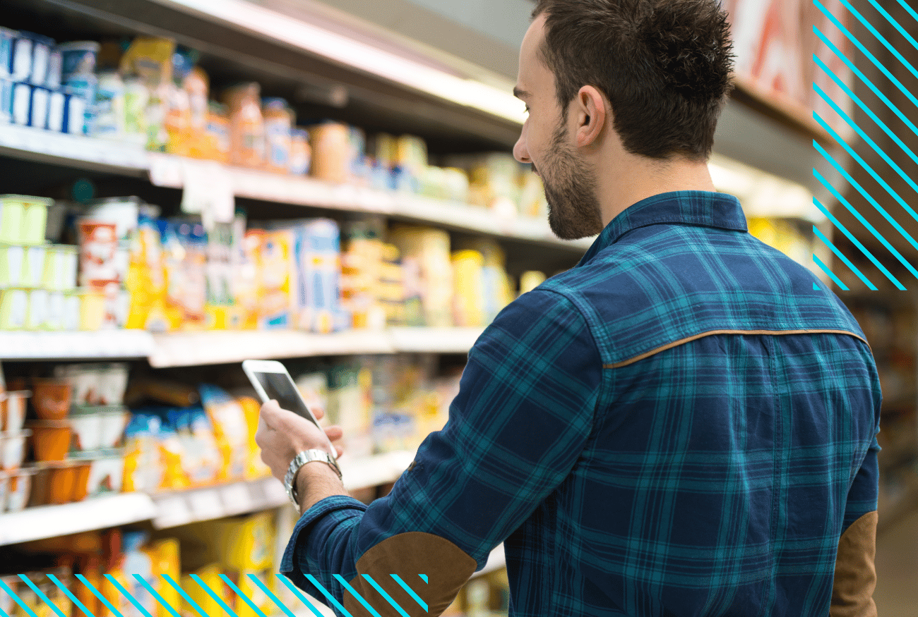 Man Shopping at Superrmarket Viewing the Product Placement on Shelf