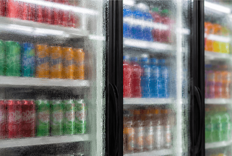 A glass retail beverage cooler with condensation illustrating challenges for computer vision AI.